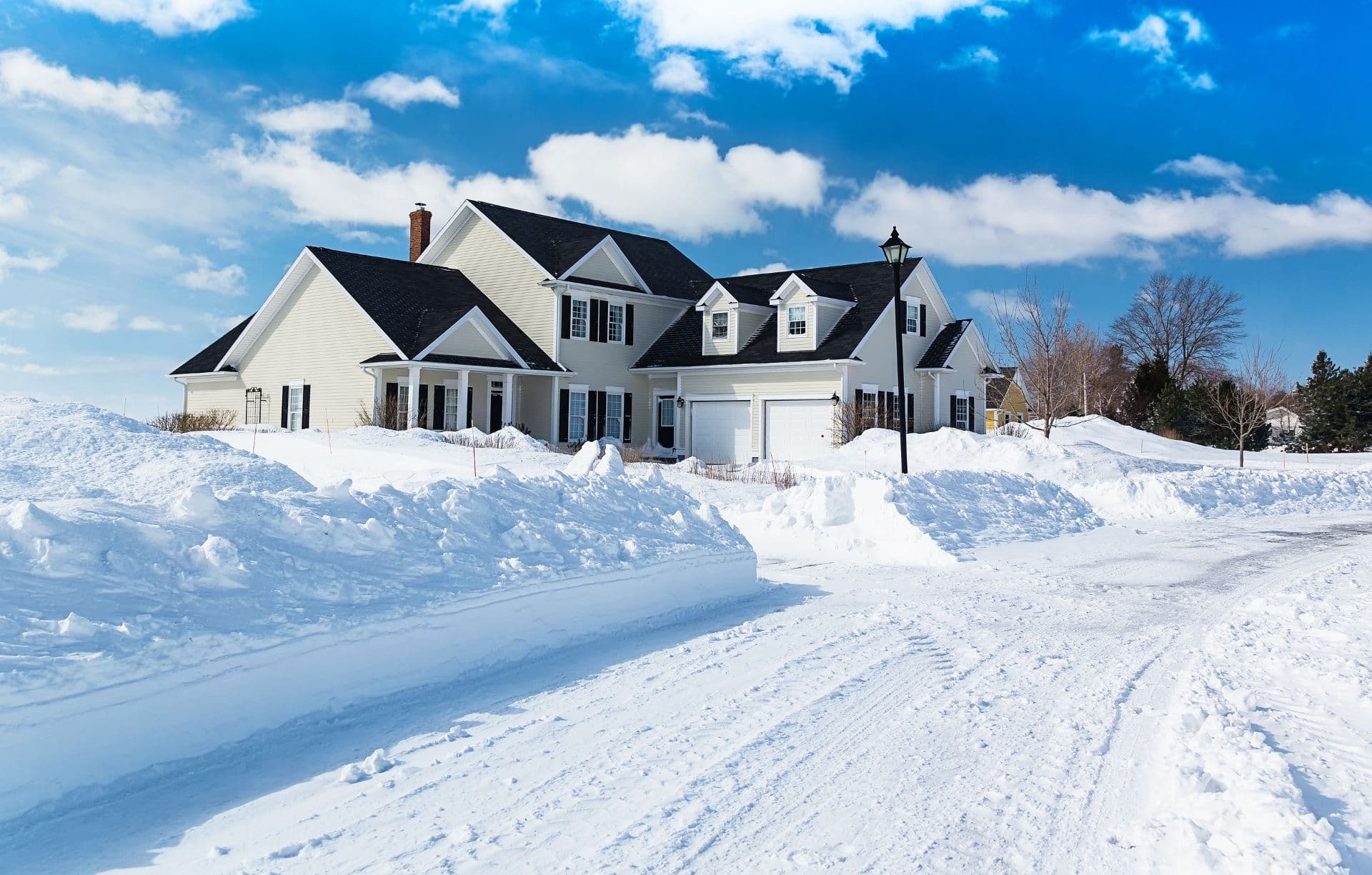 A freshly plowed road in America suburbia after a snow storm.