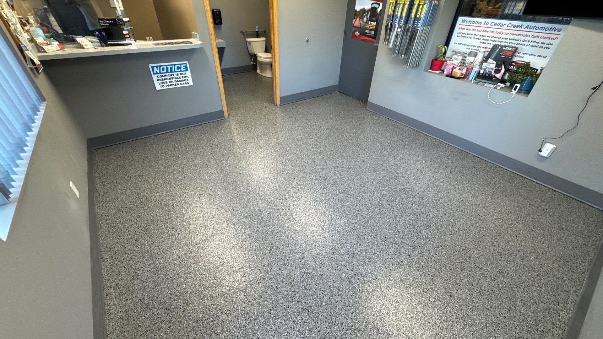 An office space with newly-coated Polyurea flake flooring.