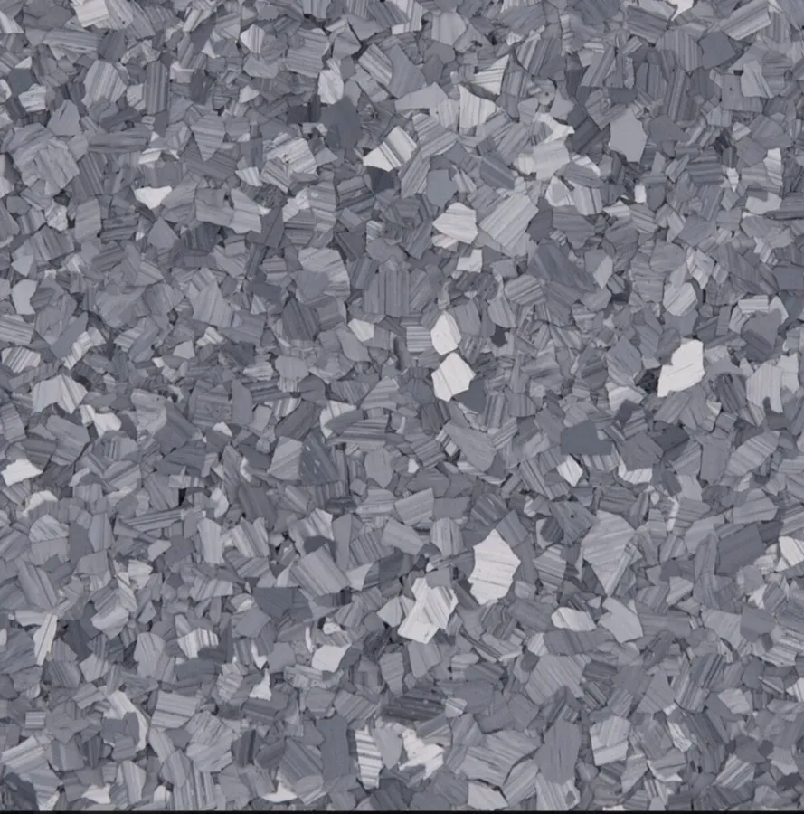 A swatch for flake flooring in the color Basalt.