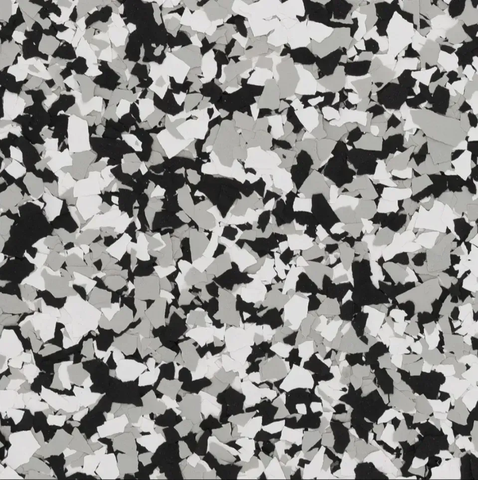 A swatch for flake flooring in the color Domino.