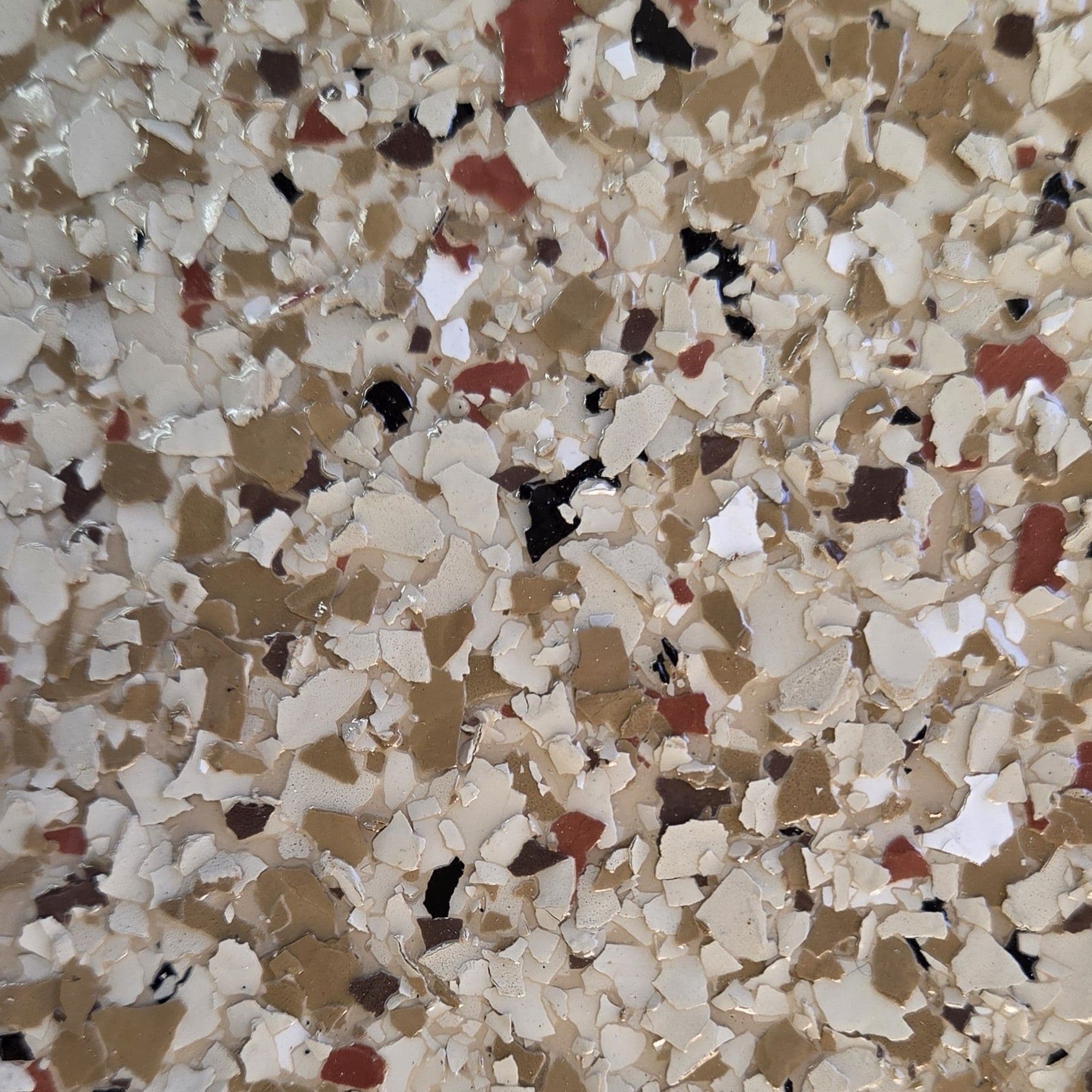 A swatch for flake flooring in the color Hickory.