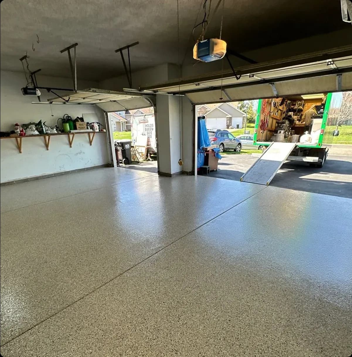 A garage with newly-coated concreted flooring.