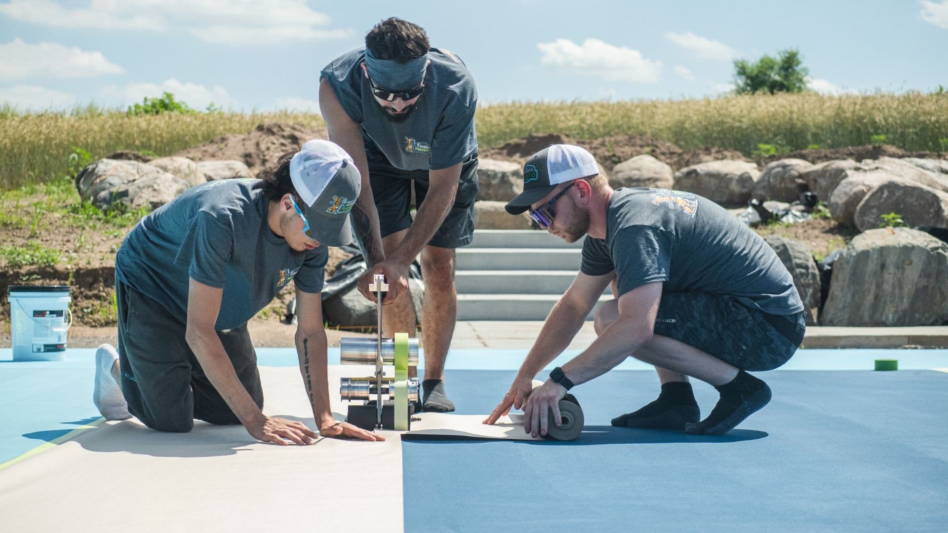 The Endless Poxybilities team works to install a pickleball court.