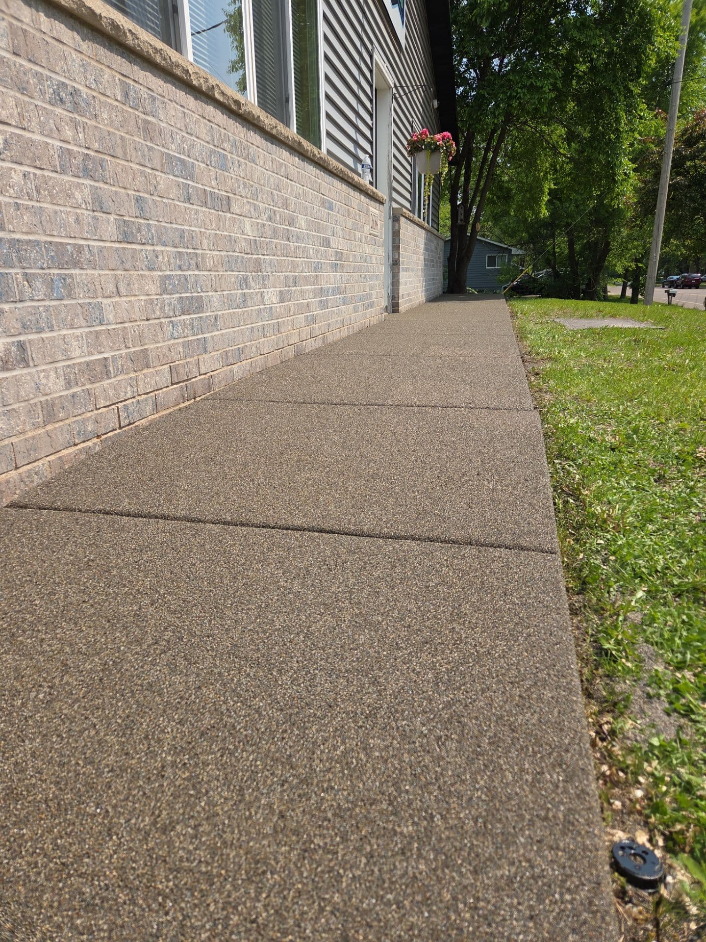 A brown Resist concrete coated walkway.