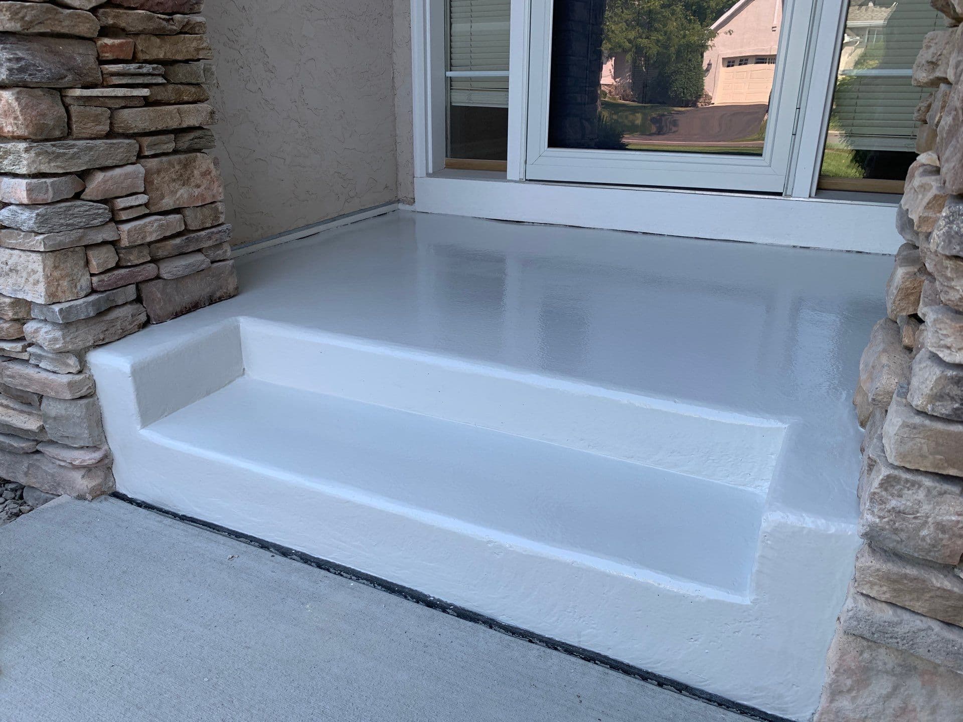 Newly-coated solid color concrete flooring.