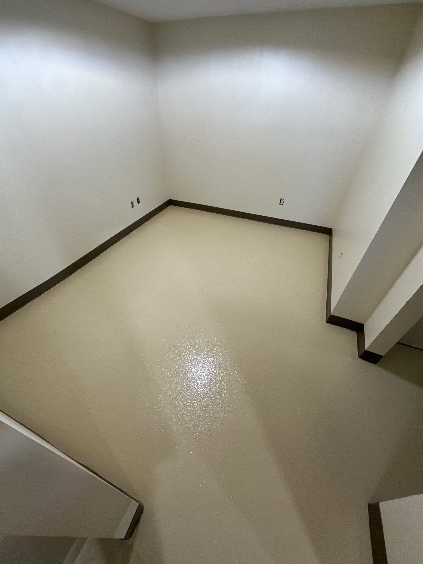 Newly-coated solid color concrete flooring.